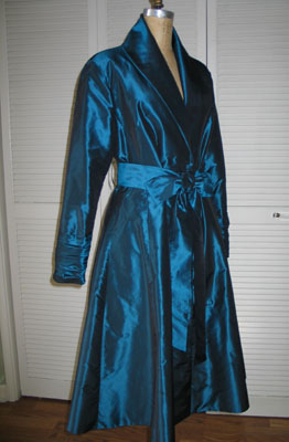 Irridescent blue silk taffeta Kathryn Hepburn style dress with shawl collar and self belt tied in bow