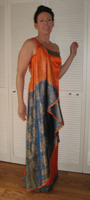 Incredible sari that bleeds from brilliant orange to teel inspired this evening gown. Carole's design highlights the beauty of the fabric.